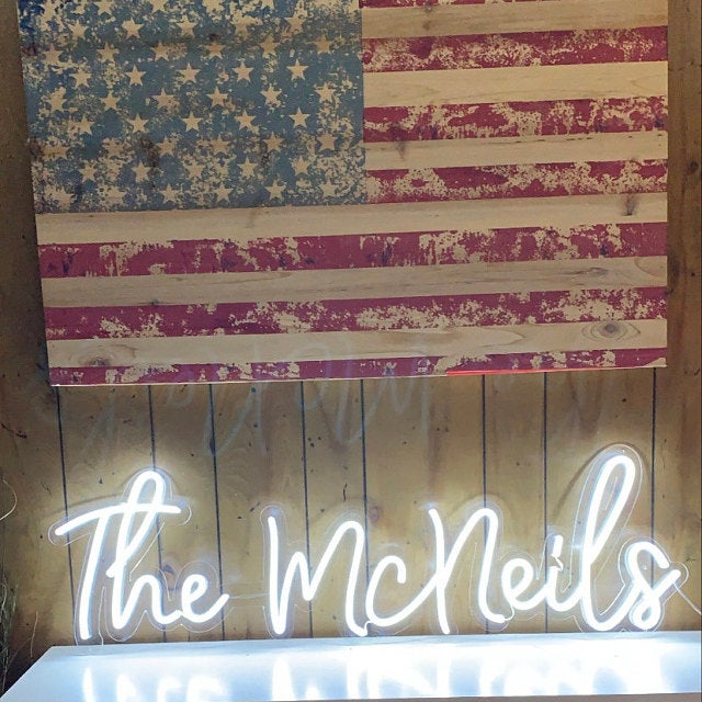 The Mcneils white neon sign