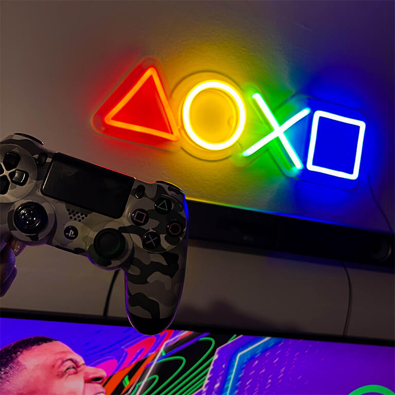 4 colors PlayStation buttons neon sign and a PlayStation controller 