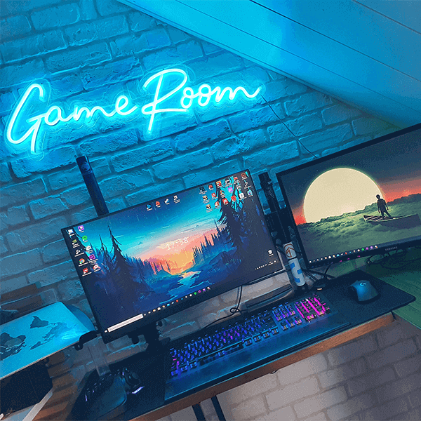 Gaming PC with turquoise game room neon sign in the background